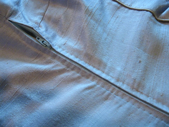 Zipper covered with placket
